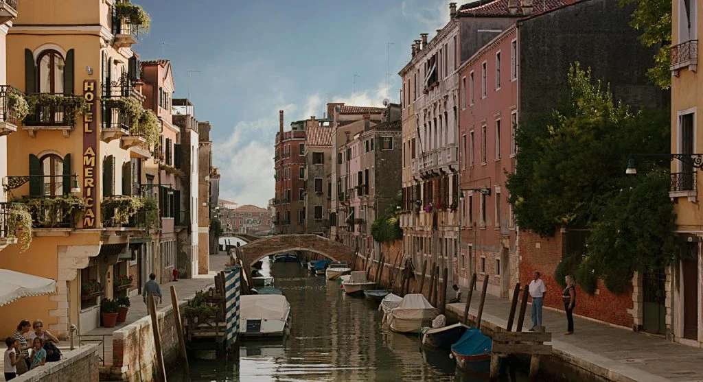 Colorful houses and boats along a historic European canal