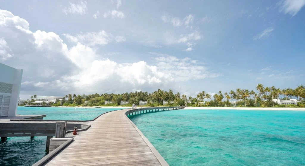 Crystal clear waters and powdery white sand beaches during a seasonal coastal vacation