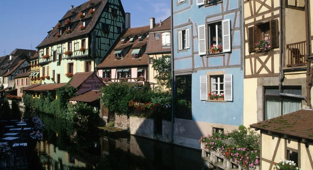 Scenic boutique canal cruise through a European village