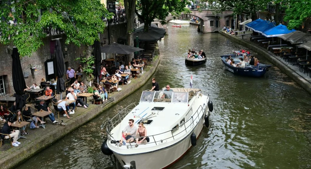 People enjoying outdoor activities on a luxury canal cruise