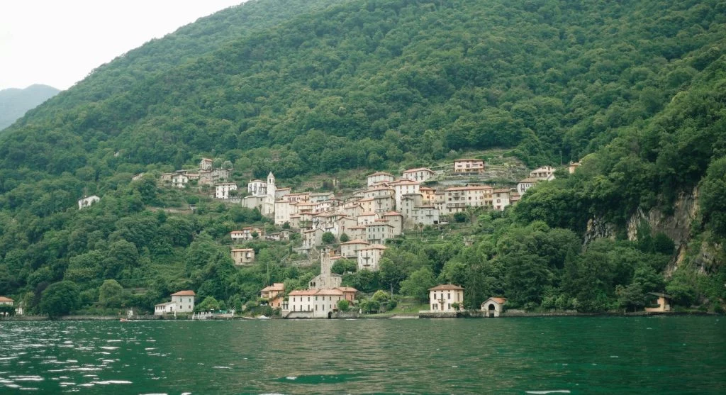 travelers near peaceful lake village