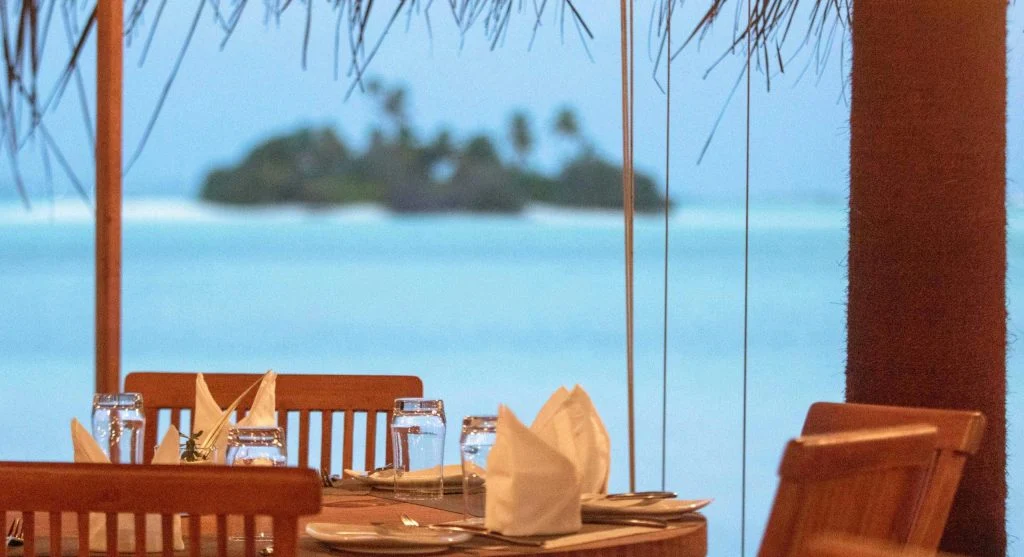 Luxury travel dining experience beside scenic waterways