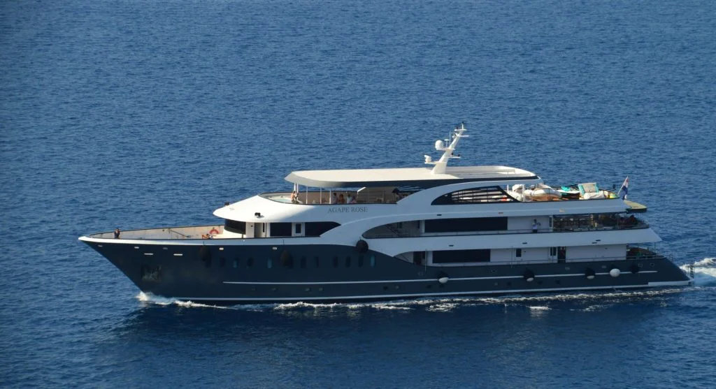 Boutique yacht sailing on calm waters