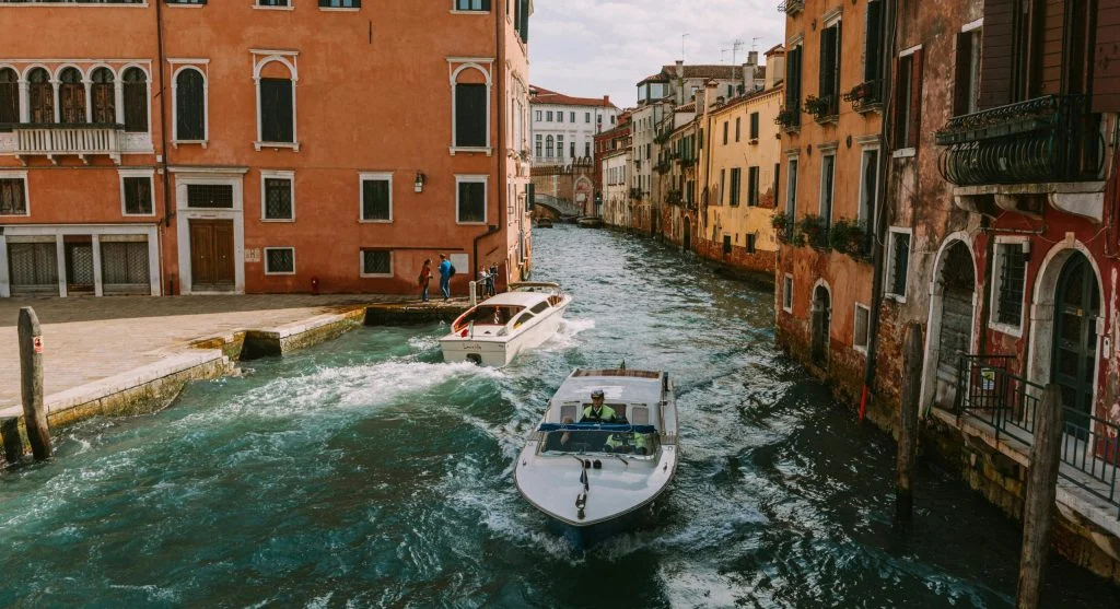 Person relaxing on a luxury canal boat wearing comfortable clothing
