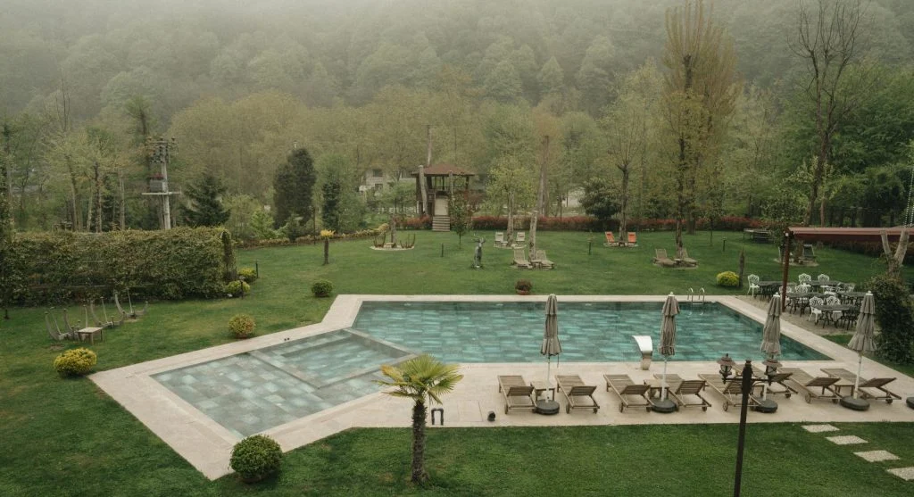 Luxury outdoor spa surrounded by trees and forest scenery