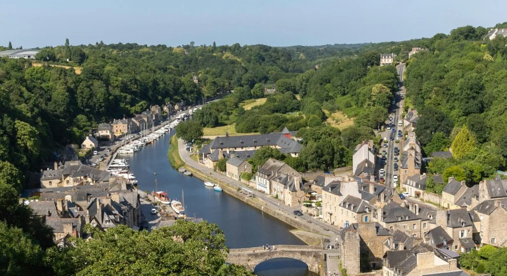 Luxury travel on a countryside canal route with lush green surroundings