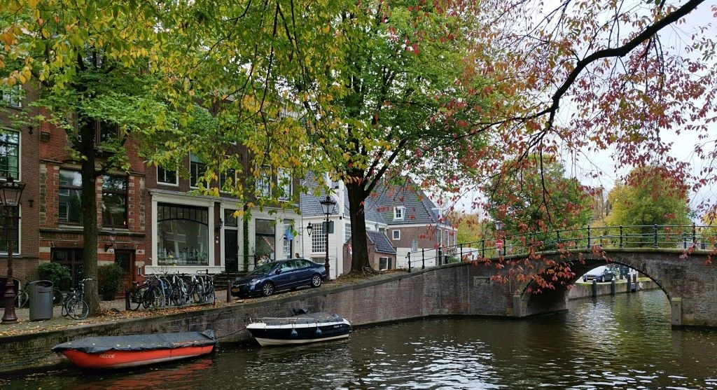 A scenic canal during autumn with leaves changing colors