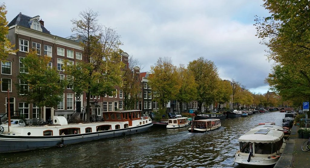 Photographer taking pictures of vineyard during canal cruise