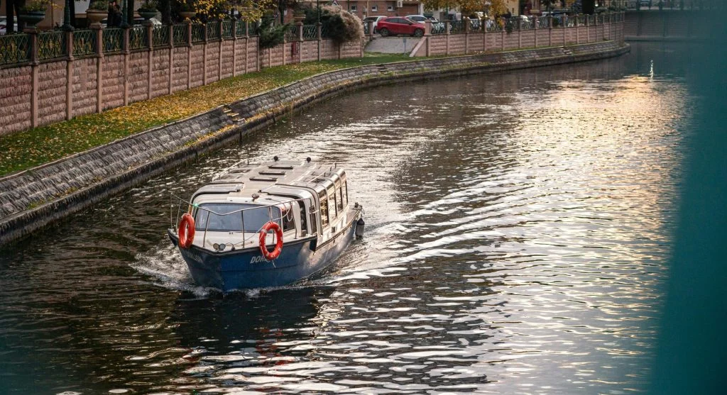 People relaxing on a luxury canal cruise boat