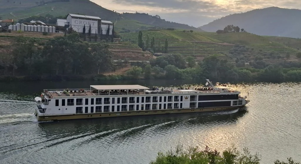 Travelers on a luxury barge cruise through French vineyards