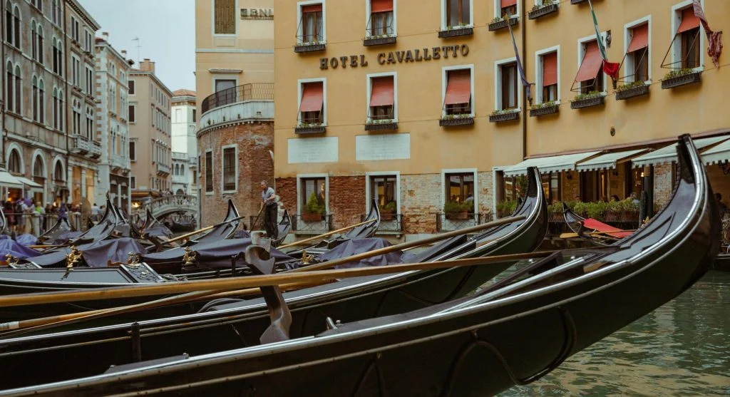 Camera capturing scenic views during luxury canal cruise travel