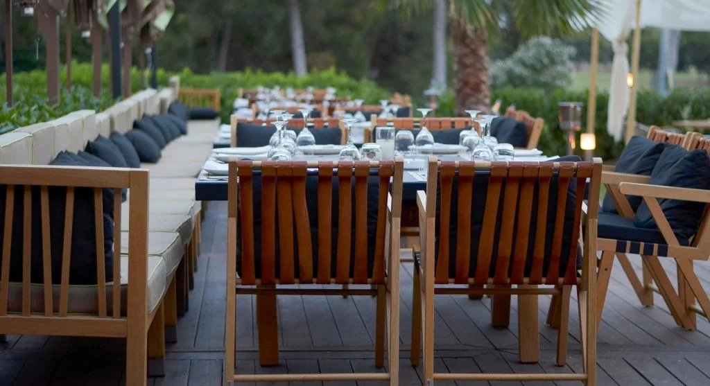 Outdoor dining table set under the stars in a luxury retreat