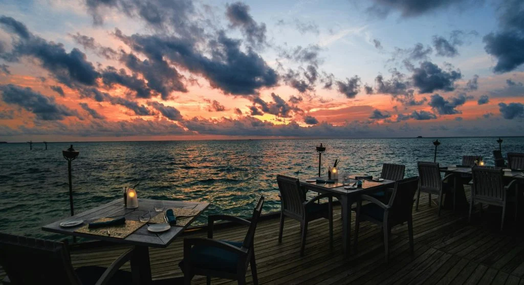 Outdoor dining during peaceful luxury coastal vacations
