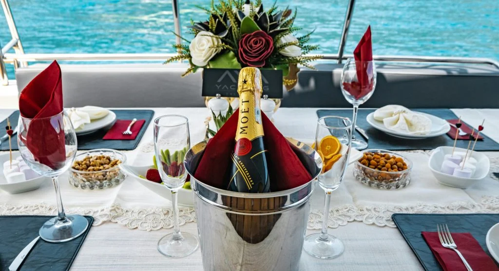 Couple enjoying personalized dining on a small yacht cruise